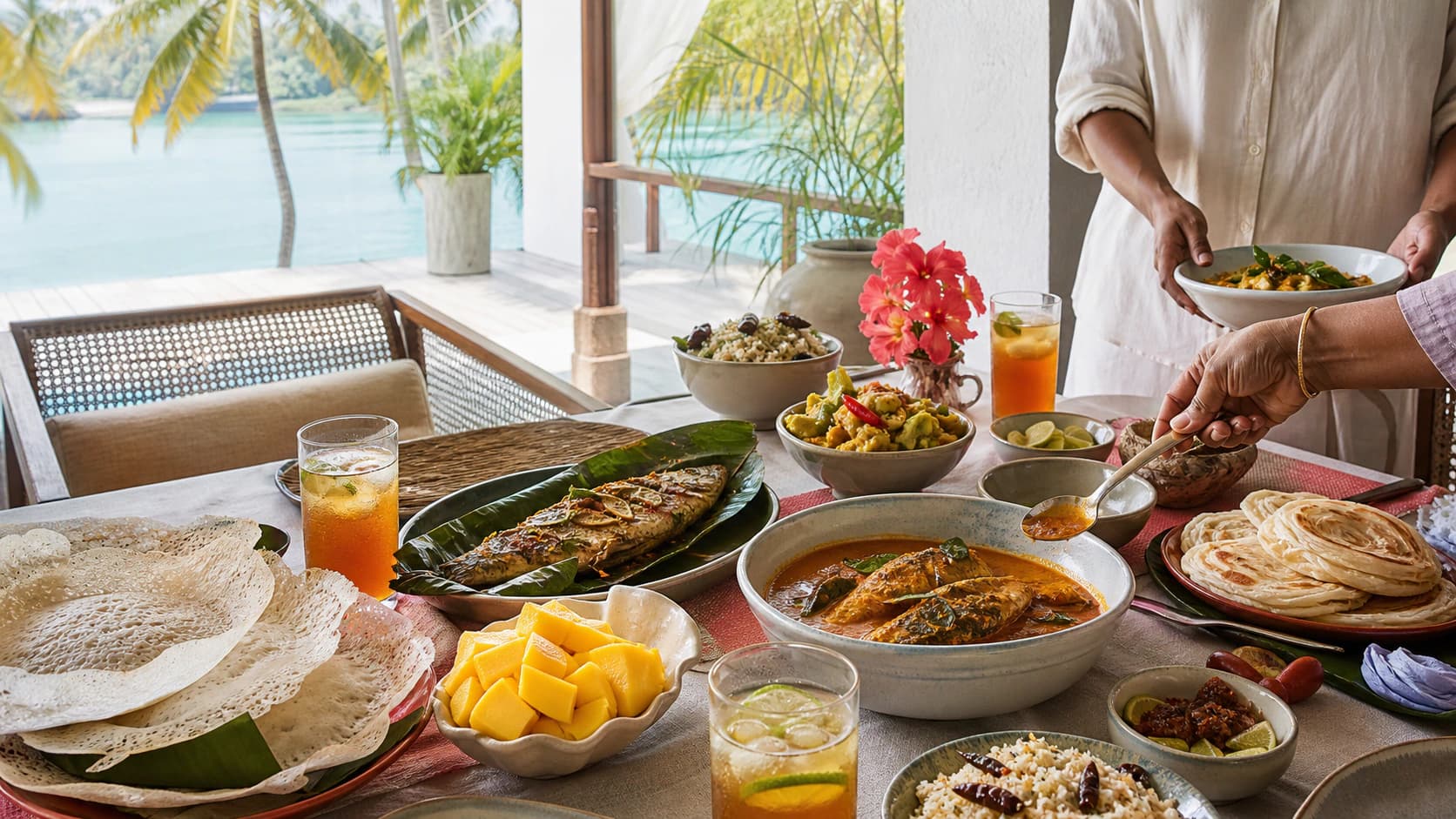 A colourful Kerala feast on a sunlit veranda overlooking tropical backwaters